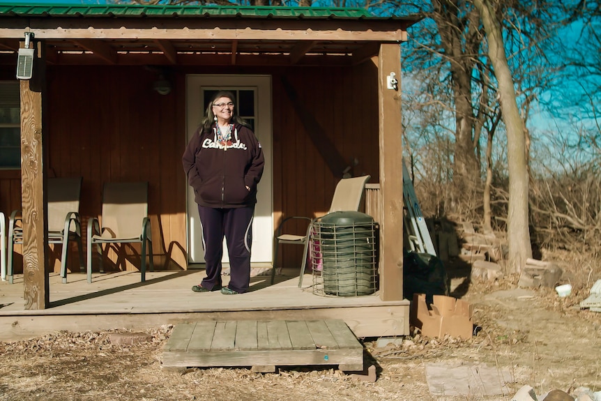 A woman on her porch.