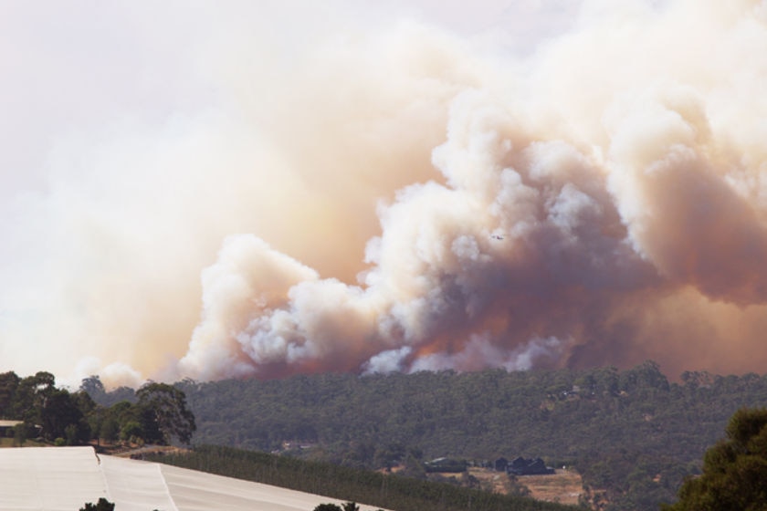 A sudden change in wind direction has driven the fire towards communities in the Dandenong Ranges.