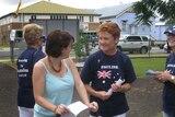 Pauline Hanson (r) hands out how to vote cards in Boonah earlier today.