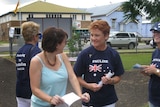 Pauline Hanson (r) hands out how to vote cards in Boonah earlier today.