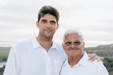 Mark Philippoussis poses with his arm around his father Nikolaos. They are both wearing white shirts