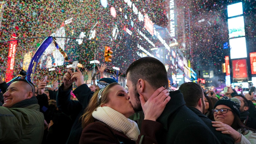 A couple kiss in Times Square for New Year 2017