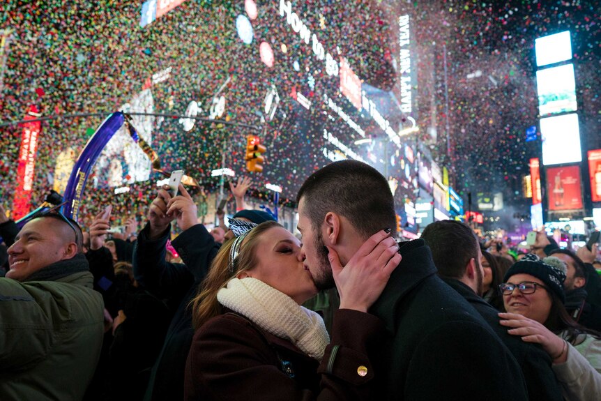 A couple kiss in Times Square for New Year 2017
