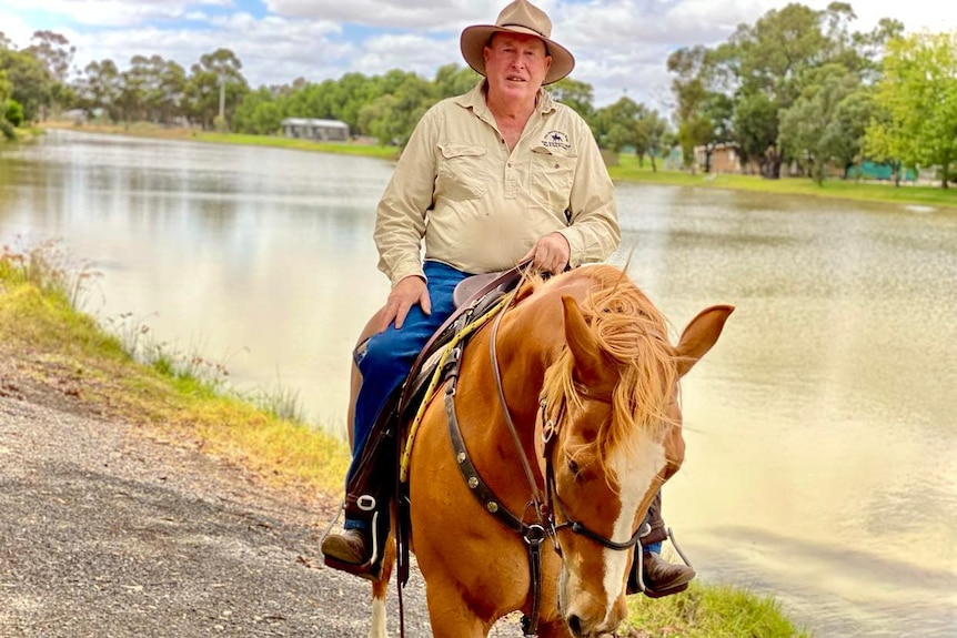 Man Riding chestnut horse