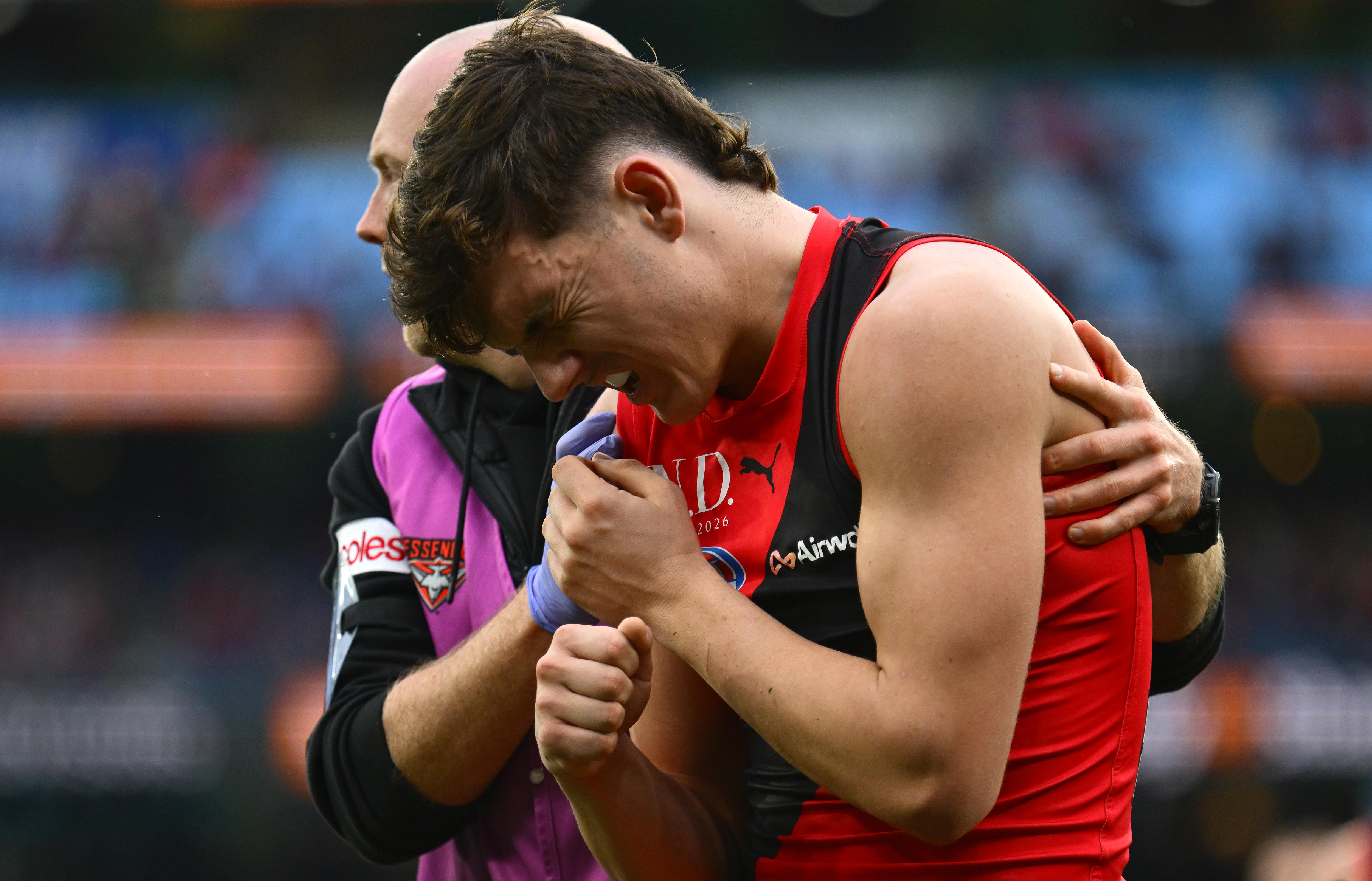 Fans at the MCG during Melbourne versus Essendon tribute match