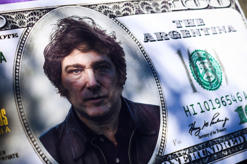 A 100-dollar bill cut-out with Argentine presidential candidate Javier Milei's face printed on it