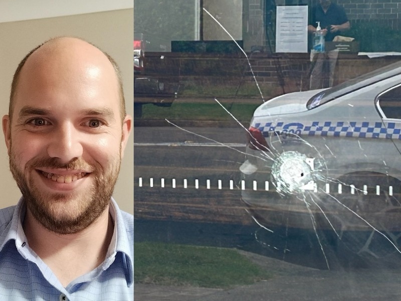 Composite of a man and a bullet hole in a glass door.