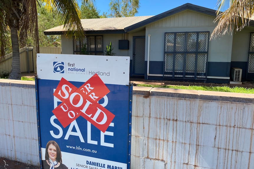 A for sale sign with a sold sticker on it outside a house in South Hedland.