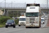 A livestock truck in traffic heading along Roe Highway.