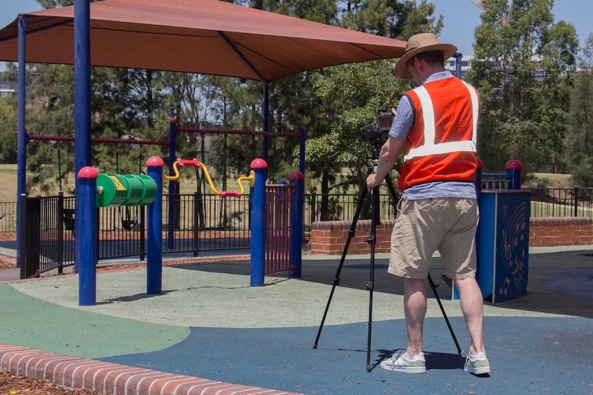 Dr Sebastian Pfautsch measuring temperatures of play equipment