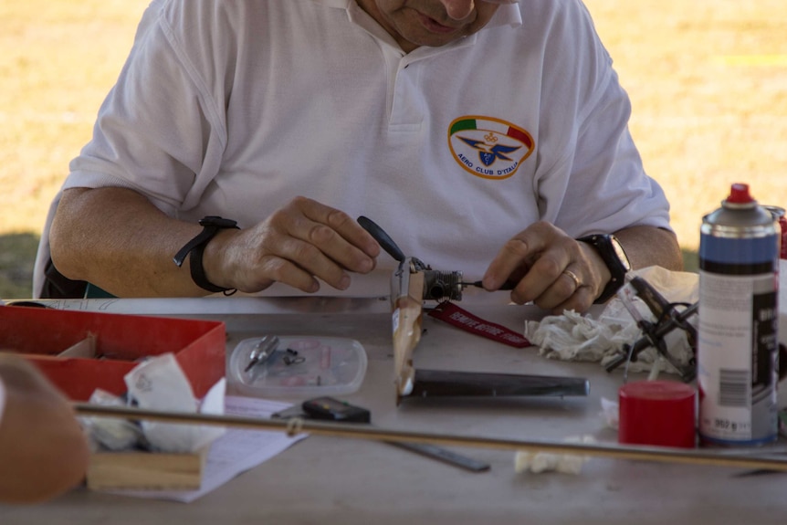 A member of the Italian team works on a model used in the outright speed competition.