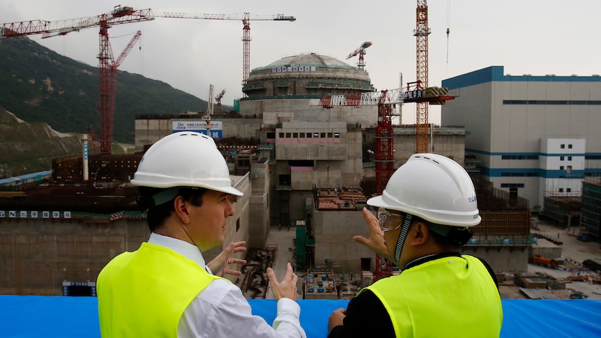 Then-British Chancellor of the Exchequer chats with General Manager of the Taishan nuclear plant as it is under construction.