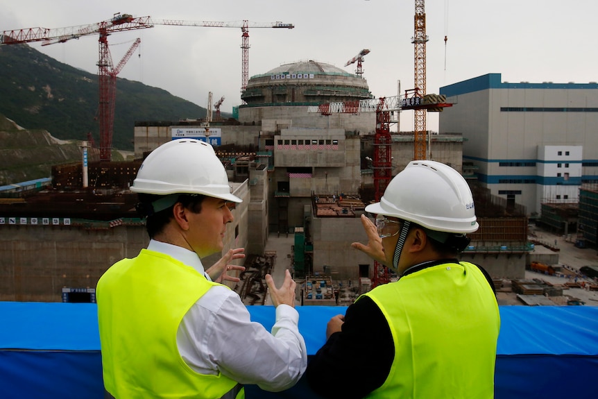 Then-British Chancellor of the Exchequer chats with General Manager of the Taishan nuclear plant as it is under construction.