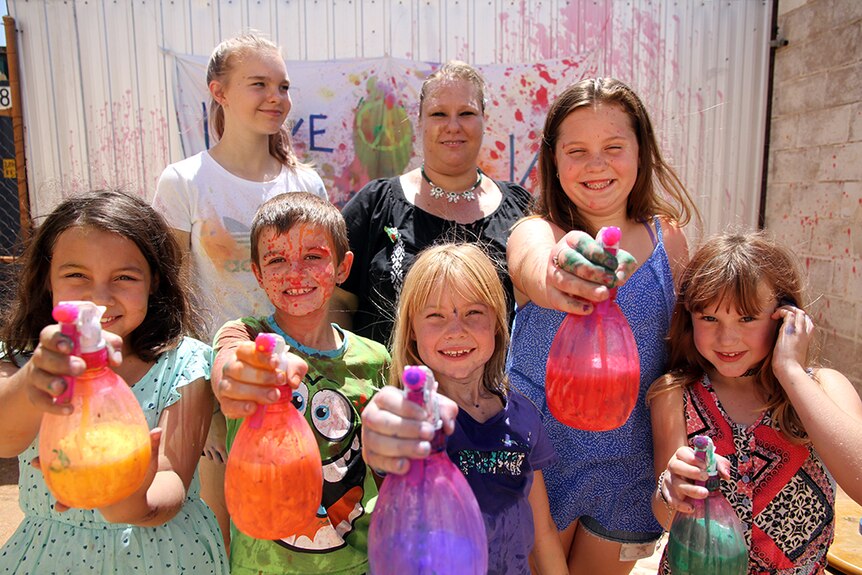 Children from the Tennant Creek Craft Club stand with Kellie McKinlay-Hughes.