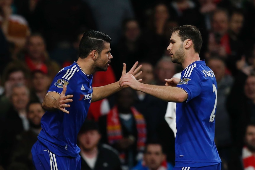 Diego Costa and Branislav Ivanovic embrace after a goal against Arsenal