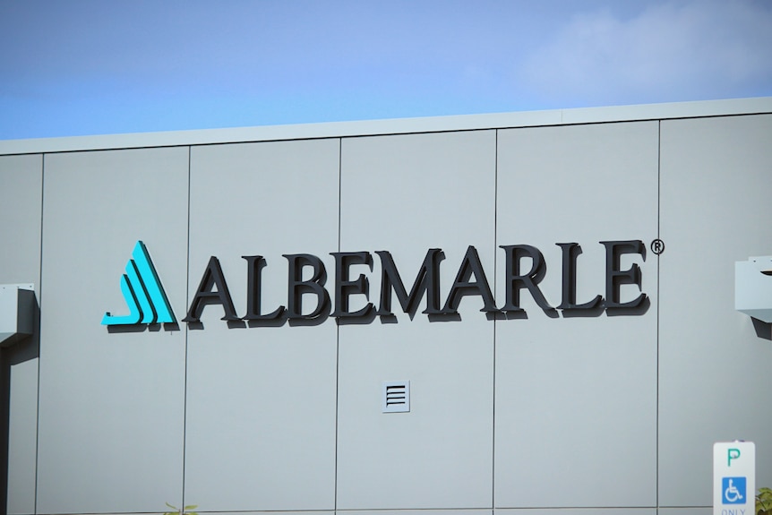 A sign that reads "Albemarle" on the side of a grey panel building