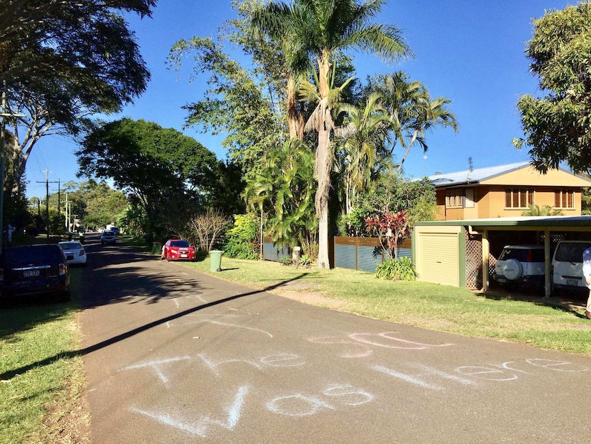 A wide photo of a street with "The SCC (sunshine coast council) was here"