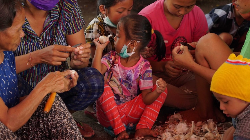 People gather at Klungkung evacuation camp.