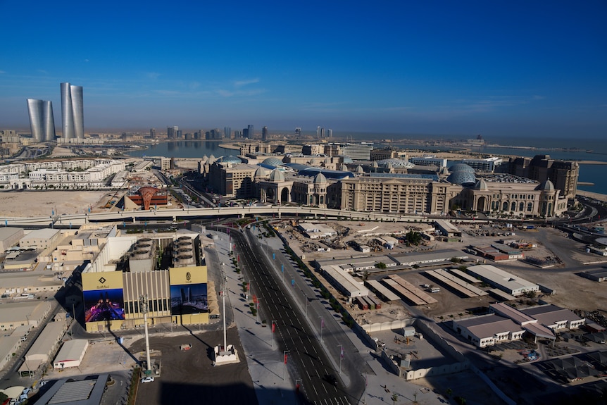an aerial view of the Place Vendome mall, right, and Lusail plaza towers