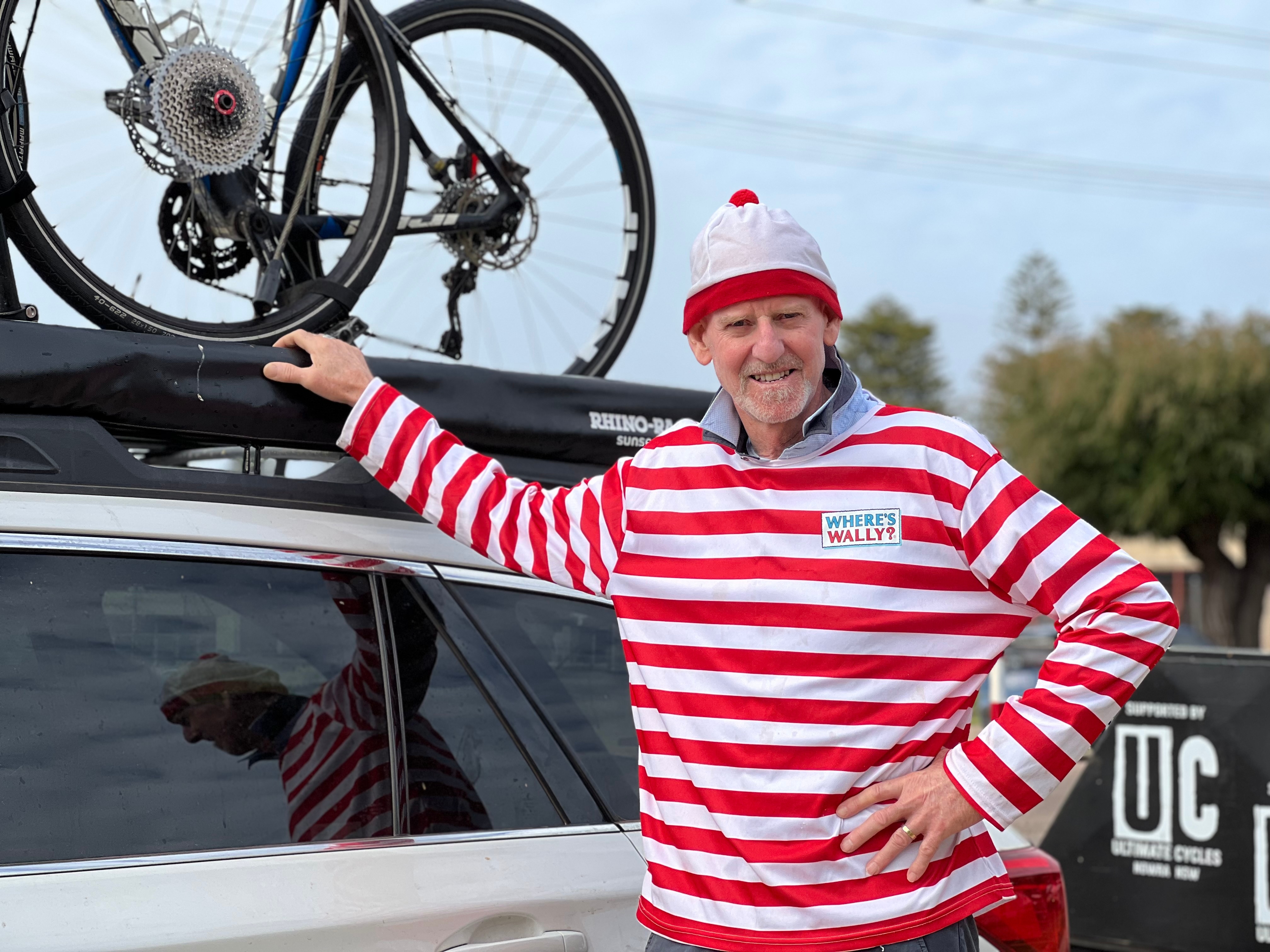 A man in a white-and-red-striped shirt.