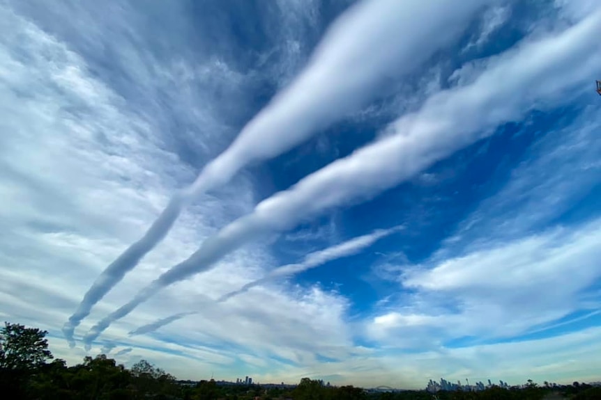 A series of roll clouds in the sky.