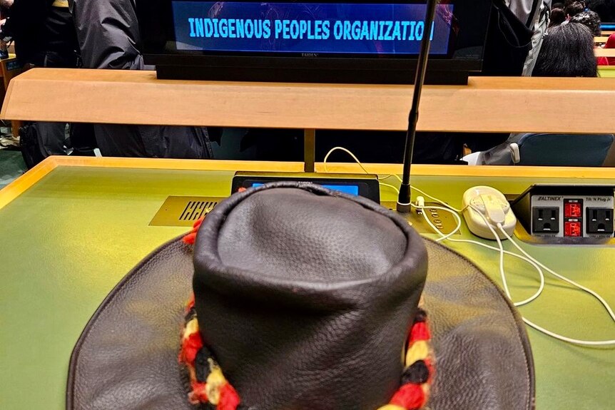 hat with aboriginal ribbon on a UN table