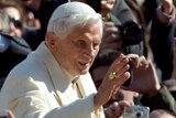 Pope Benedict greets people in St Peter's Square