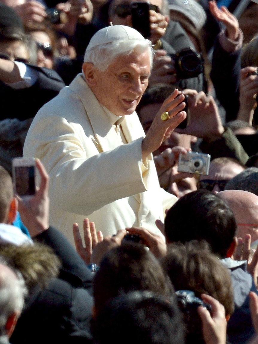 Pope Benedict greets people in St Peter's Square