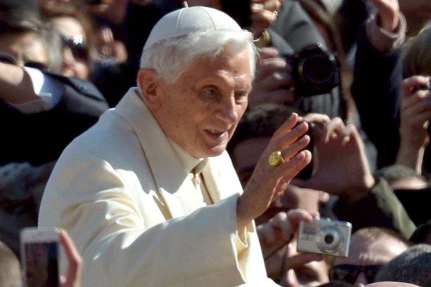 Pope Benedict greets people in St Peter's Square