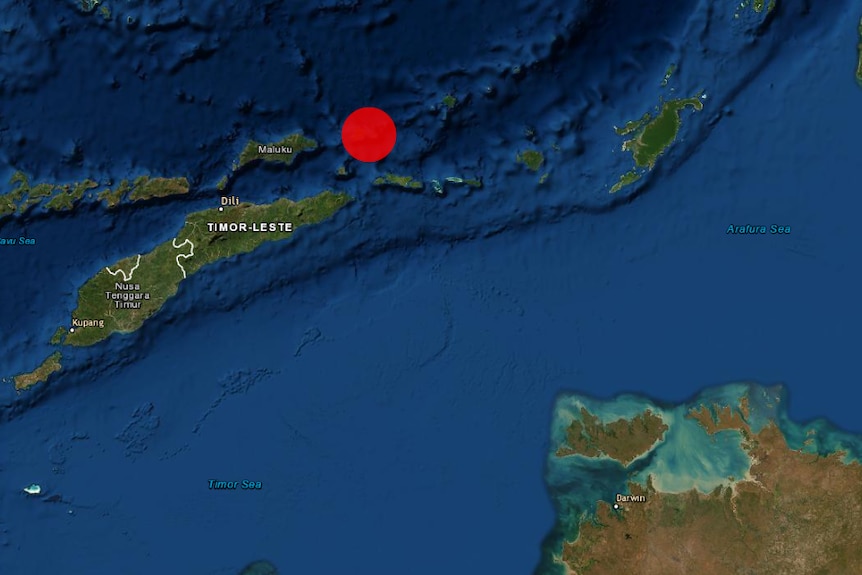 A satellite image or map showing a red dot at the epicentre above Timor-Leste, showing a distance across water to Darwin.