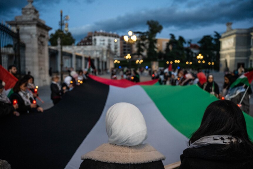 Palestinians attending a vigil