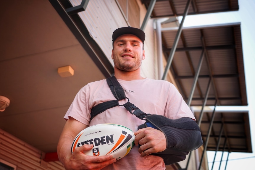 Angus Crichton with his arm in a sling