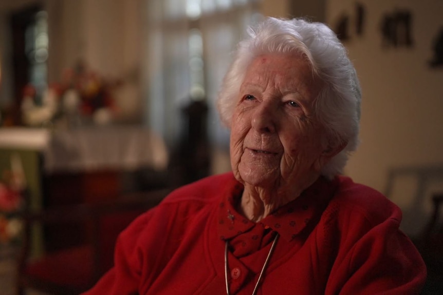 An elderly woman smiling