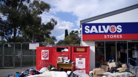 Donations and rubbish dumped outside Salvation Army store in Canberra.