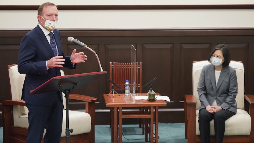 Former PM Tony Abbott gestures while speaking at an event with Taiwanese president Tsai Ing-wen