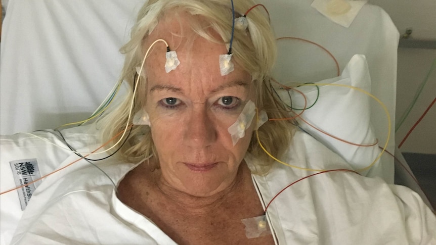 Woman receiving an electroencephalogram in hospital.