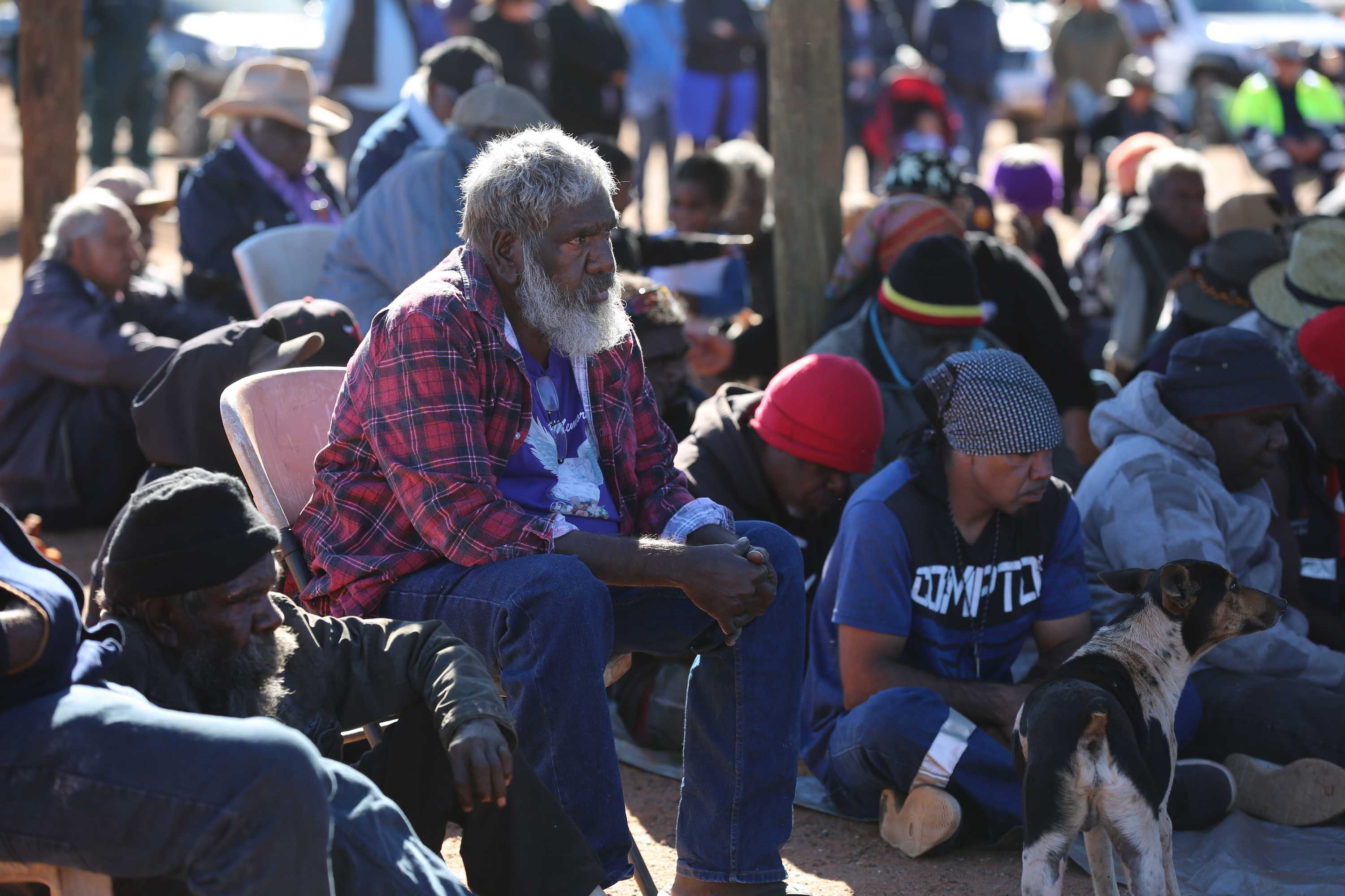 Jigalong elder Brian Samson sits among mourners at Daisy Kadibil's funeral.