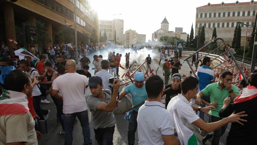 Security forces shot into the air and police fired tear gas to repulse the hundreds of protesters.