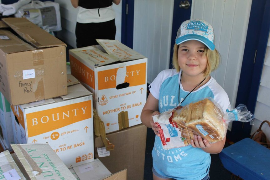 Rori Matthews helping with supplies after Cyclone Debbie