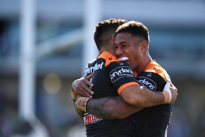 Michael Chee Kam celebrates a try