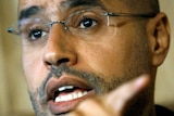 Saif al-Islam speaks during an interview