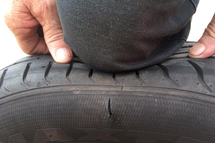 A car tyre that has been slashed with a knife