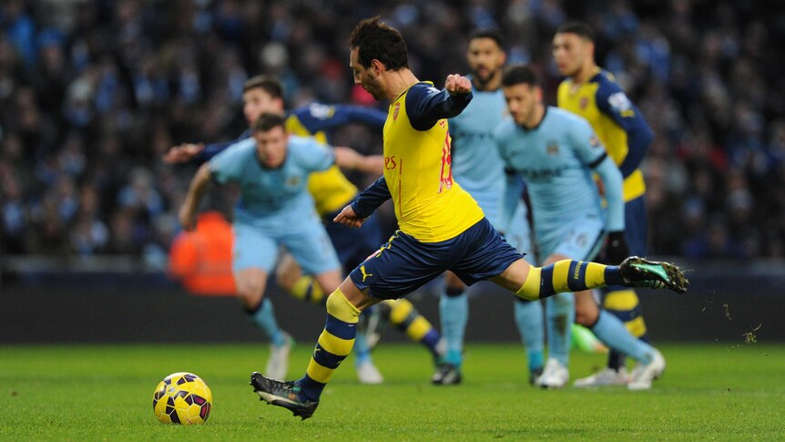 Santi Cazorla takes a penalty against Manchester City