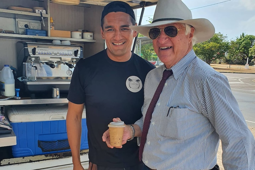 Two men at a coffee van.
