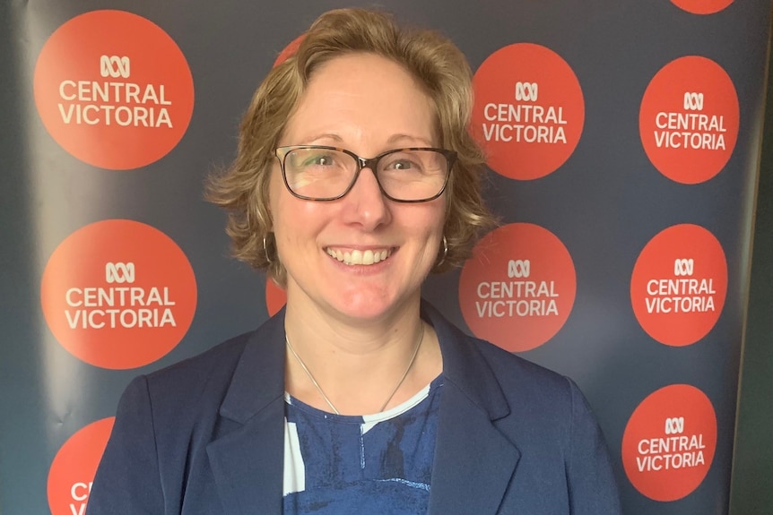 Dr Kirsty Forsdike standing in front of an ABC Central Victoria banner.