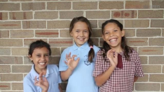 Three smiling Indigenous children
