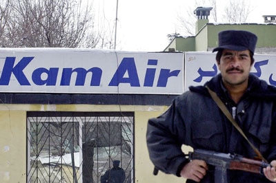 An Afghan soldier guards the Kam Air office in Kabul