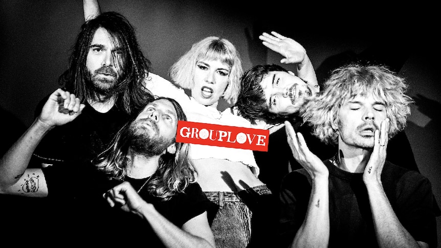 Black and white image of Grouplove; Hannah Hooper in white shirt, other members in black; red GROUPLOVE logo
