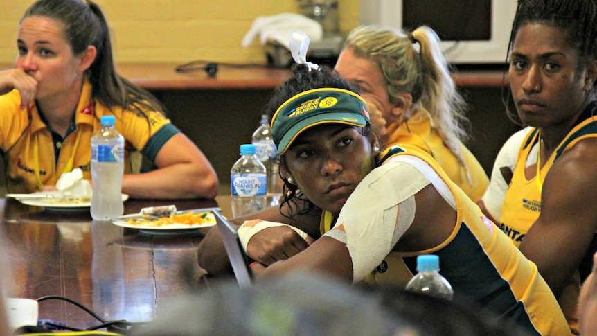 Mahalia Murphy (hat) and Ellia Green (far right) at the pre-game briefing