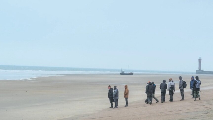 The crew on the Dunkirk film survey the vast surrounds they are filming on.